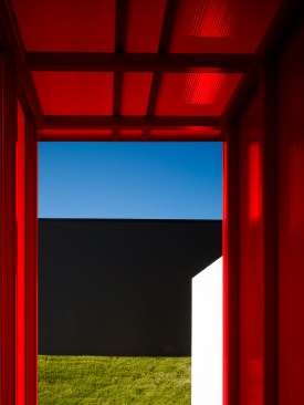 The east entry between buildings completes the composition of red, white and black.  