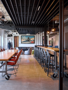 Highly flexible communal spaces feature movable furniture for maximum adaptability.