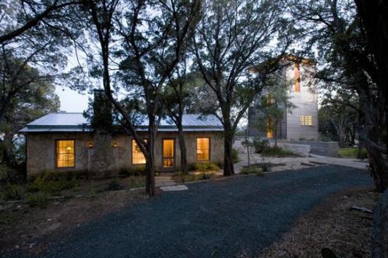 The old 1930s stone cabin serves as the living room, while the new adjacent tower contains the bedrooms.