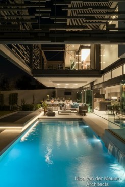 Outdoor area and rear facade with floating cantilevered balcony