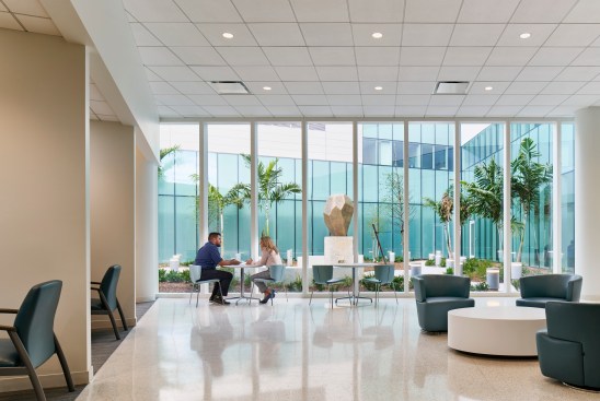 Seating area in the surgery welcome center, which faces an outdoor courtyard