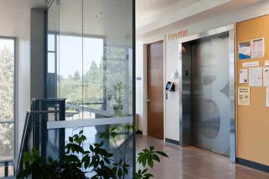 Stainless Steel Elevator Doors in Satin finish with custom Eco-Etch pattern at Clackamas Community College - Harmony Campus, Milwaukie, Oregon