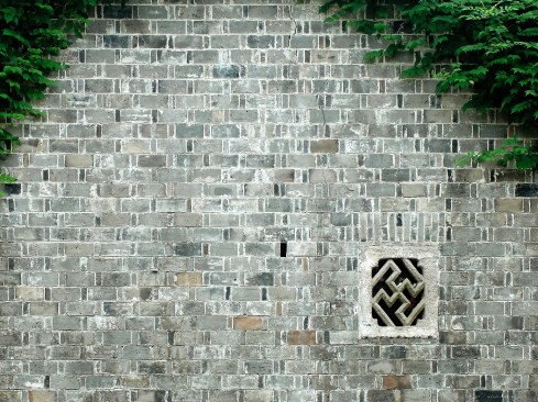 A traditional masonry wall for a residence in Zhejiang, Hangzhou, is the precedent for constructions like Building 15's permeable wall (shown above).