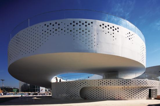 Danish pavilion - BIG

 Bjarke Ingels and colleagues convey the Danes' athleticism—and sentimentality—with a velodrome that circles Copenhagen's Little Mermaid statue, imported for the occasion.