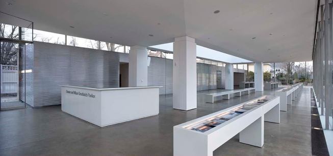 The pavilion’s structure—an inverted hipped roof—speaks to the architectural geometries of the Martin House, and allowed Mori to design a long, open space free of structural obstructions, save for the four columns that support the roof and frame a large rectangular skylight that delivers natural light to the center of the space. The ceiling plane is kept clear of light fi xtures so that it can function as a giant reflector. The ceiling’s luminous properties are most apparent at night when the light from the 39W inground metal halide uplights—located along the perimeter of the pavilion at the base of the curtain wall—bounces off the surface and the entire plane glows. T5 linear fluorescent fixtures hidden in the top of the concrete core (which houses back-of-house support spaces) on the west elevation provide additional uplighting. LED striplights in the exhibit display cases add a hint of accent light.

ELLIPTIPAR COVELIGHT (STYLE 305)

This asymmetrical T5 kit delivers precise optical control for superb projection of light from perimeter coves. It is compatible with 28W T5 and 55W T5HO lamps in 2-, 3-, 4-, or 5-foot lengths. At 2 5/8 inches high, it can fit within the narrowest coves, while its two bright, anodized aluminum parabolic reflectors drive light across any surface, minimizing glare and maximizing efficiency. Placed atop the concrete core of the Martin House Visitor Center, this luminaire picks up where the inground uplights leave off for an uninterrupted wash of light across the ceiling. elliptipar.com

WE-EF INGROUND UPLIGHT (MODEL 611-3050)

 With its 39W ceramic metal halide lamp, this flush-mounted inground uplight is ideal for applications, indoors or out, where precise beam control is required. It features a “no-tool” removable lamp-ballast-reflector module for easy maintenance, a sturdy stainless-steel body and lens frame in a brushed finish, and clear tempered glass lens for walk- and drive-over applications. Measuring 9.8 inches in diameter at surface grade, 14 3/4 inches is needed for inground depth. At the Martin House Visitor Center the luminaires were located in a perimeter trench and outfitted with two different lenses—one six degrees and the other 20 degrees—and two different reflectors—wide and medium beam—to achieve an even distribution of light across the ceiling plane. weef.de