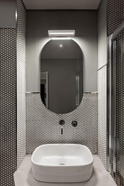 Bathroom with circular mosaic covering

