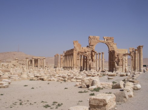 Ruins of the Roman triumphal arch at Palmyra as photographed in 2006.