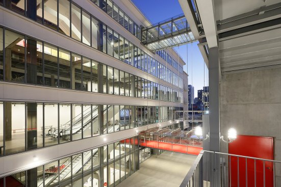 Red-carpeted pedestrian bridges link the Saban Building to the Sphere