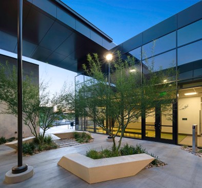 Desert adaptive plant material and landforms provide a traditional approach of 
the local environment working with the natural surroundings. The use of tiered 
landforms as well as a fractured, organic layout of planters and seating introduce 
several strategic “people” spaces throughout the site.  Whether students or faculty wish to sit in groups or enjoy a quiet respite, the organic spaces provide these different environments. 