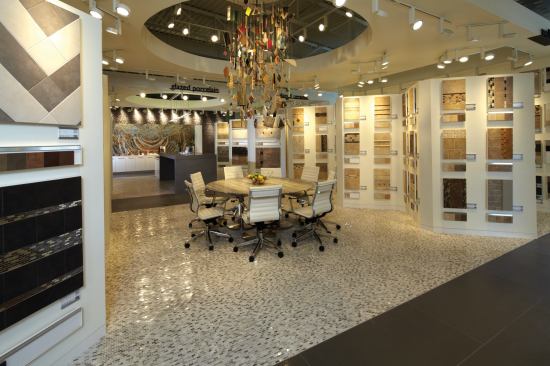At the center of the studio, a chandelier made from Daltile products hangs from the ceiling.