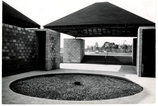 When the bath house was completed in 1955, the central plaza around which the four-pavilion complex is oriented was inscribed with an inset circle and filled with gravel. Meant to mimic a fountain, at least in prominence, and to serve as a focal point for the complex, the circle was filled in with concrete over time to comply with ADA codes for universal access.