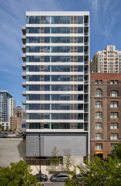 Glass-and-concrete west façade, along South Wabash Avenue