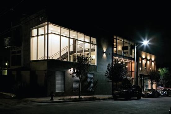 The architects of this live/work unit in Venice, Calif., wanted the residential upper level to have a modern-but-warm feel. To help achieve that, the brick and steel used on the office space façade gives way to 12-foot-tall windows that wrap the living area of the rear residential unit above. Project: Rose Avenue Residence and Studio, Venice, Calif.; Architect/Builder: Reed Architectural Group, Venice