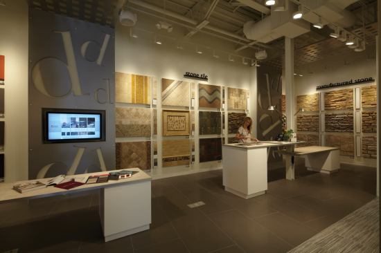 One of the technogolical innovations of the design studio is a large-scale touchscreen computer (left), which allows clients to configure spaces according to their tastes, with hundreds of tile and grout options over a wide range of backgrounds.
