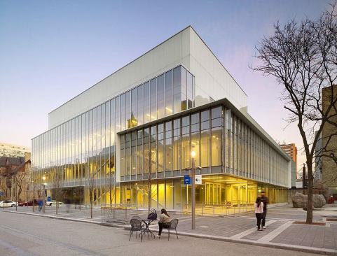 The building’s west elevation seen during the day.