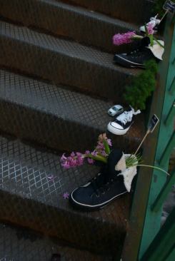 Basketball shoes double as planters on the streets of Milan.