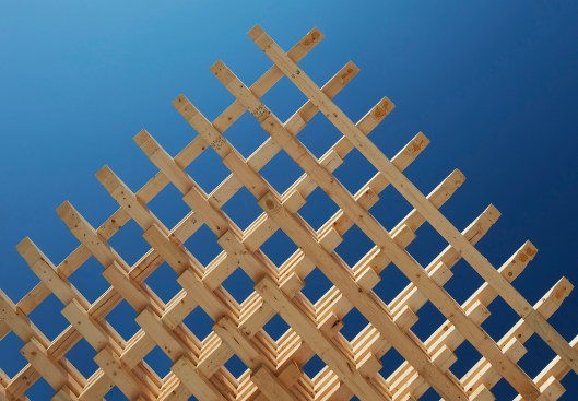 Precisely cut-wood beams are fitted together with scarf-and-lap joinery
