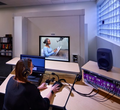 Volunteers and staff produce audio recordings of requested materials within the studio space of the upper floors.