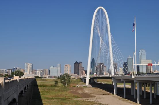 The Dallas skyline is visible beyond the bridge when&nbsp;looking&nbsp;east toward downtown.&nbsp;The old bridge sits&nbsp;to the north (left, in the photo) of the New Margaret Hunt Hill Bridge.