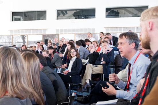 An audience member poses a question during a Q-and-A session.