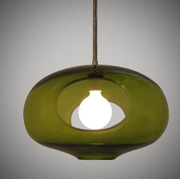 This light fixture is made from hand-blown glass and features a carved-out design that allows you to see inside the unit and permits light to spill out. It comes in two styles—tall or wide open—and a variety of colors. 
www.jamieharris.com.