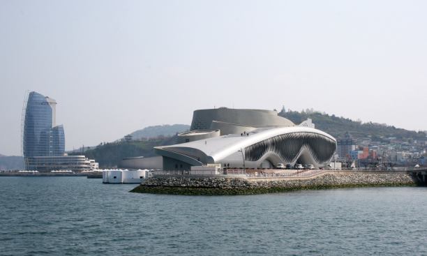 At Expo 2012, the rippling motion of the Theme Pavilion's kinetic façade is discernible from across a causeway.