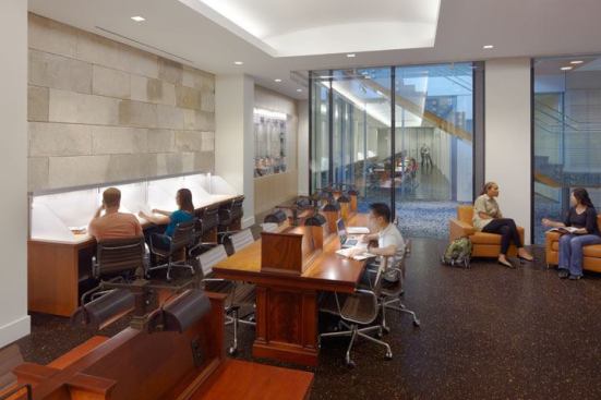 Reading rooms, located two floors below grade, are made to feel bright and airy with the use of 32W T8 fluorescent cove fixtures, 20W LED downlights and additional illumination from the feature stair. New contemporary-styled carrel lighting complements the refurbished antique carrels.