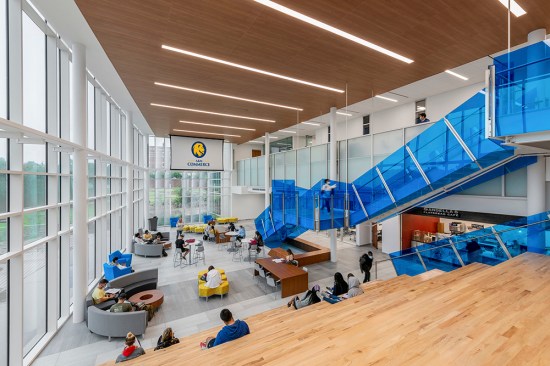 The two-story lobby serves multiple purposes: a building entry point, a study and meeting space and a place for gathering.