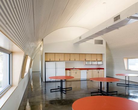 T5HO striplights and ductwork were positioned to allow for maximum luminance distribution across the vaulted ceiling while minimizing shadow lines on the adjacent walls. 