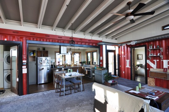 Missouri University of Science and Technology's Nest Home is not your typical shipping container house: Clad on the exterior in wood reclaimed from shipping pallets, the house reveals its character inside with containers configured in a non-orthogonal arrangement to create intimate spaces around a central living room.&nbsp;