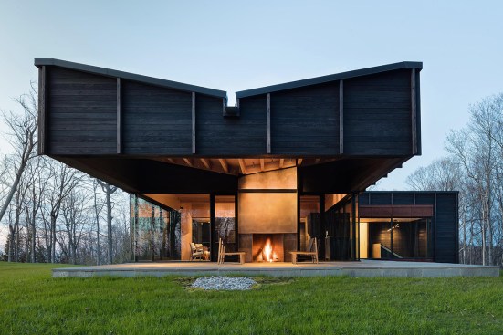 A 20-foot-long cantilevered roof shelters an outdoor terrace on the house’s southwest side.