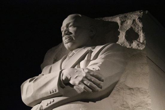 Dr. King’s silhouette in the Stone of Hope as seen at night. The 3-dimensional quality of the sculpture is enriched through the creative application of highlights and shadows using various beam shaping devices.