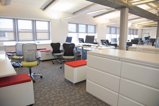 The prototype office, located on the seventh floor of the GSA headquarters, has an open worktables with reservable and non-reservable workstations.