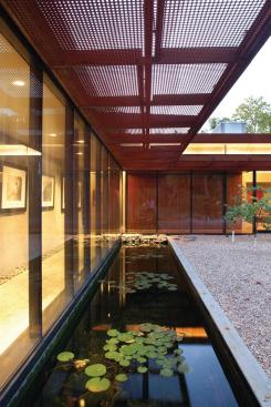 Some of the panels are hung horizontally instead of vertically to form a brise soleil.