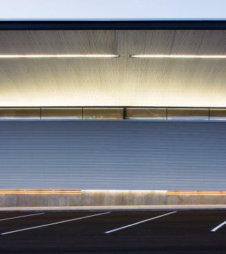 Material transitions on the fa&ccedil;ade are distinguished by linear bands of light.