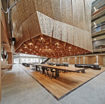 A meeting spacesits  under the structure of the Suspended Studio in the atrium.