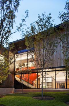 A view of the rear entrance. The illuminated ceiling surfaces reflect light onto the walls and display areas.