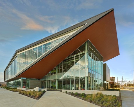 A dynamic cantilevered open auditorium floats completely free above the main entrance, lifting to the north as a bold progressive language of hope.