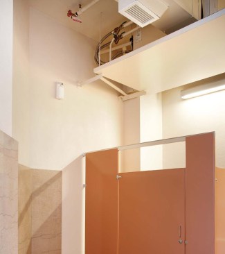 While secreted in most of the building's historic spaces, the new high-efficiency HVAC system can be seen in a third-floor conference room and restroom.