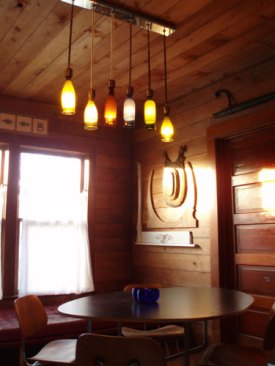 dining area with bottle chandelier