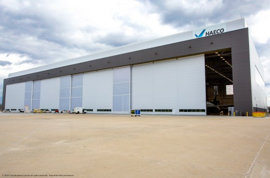 The hangar incorporates  EXTECH's LIGHTWALL 3440 interlocking polycarbonate translucent wall system as part of the building envelope's upper portion as clerestory sections, at its corners and on its three massive doors.