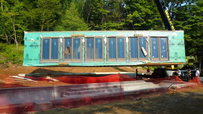 Prefab module being set by crane