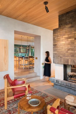 Living area looking into raised kitchen
