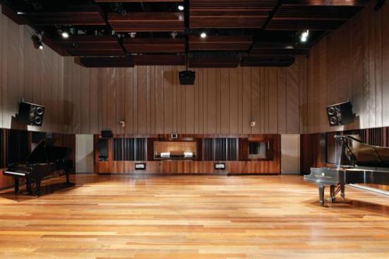 The recording studio located on the south end of the building is the most acoustically sensitive room in the building. To isolate the room from the rest of the facility, the walls are a massive 4 feet, 1 inch thick. The ceiling has to protect the studio from airplane noise and vibrations, because the building is on the flight path to the Cleveland airport. The green roof directly above the studio adds extra mass that helps block the roar of 747s passing overhead.