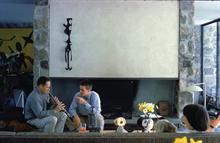 CONNECTICUT, UNITED STATES - 1963: Architect Eliot Noyes (L) playing oboe while son Eliot Jr. gives advice in living room of house designed by Noyes. (Photo by George Silk/Time & Life Pictures/Getty Images