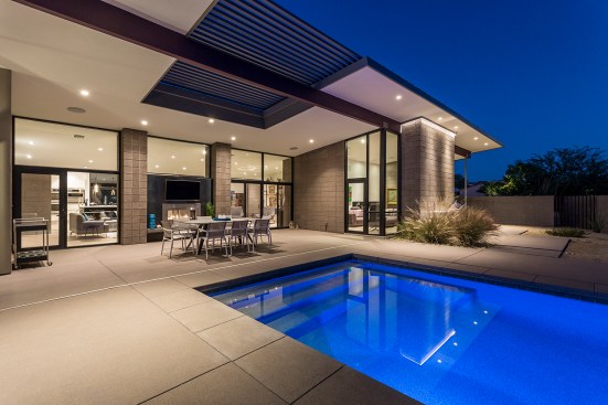 Pool is centered on the main fireplace element of the home.  The fireplace is 2 sided and is engineered 
to allow for open glass above fire place which frames the mountain beyond. 