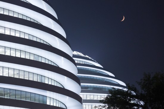 Night view of lit towers.