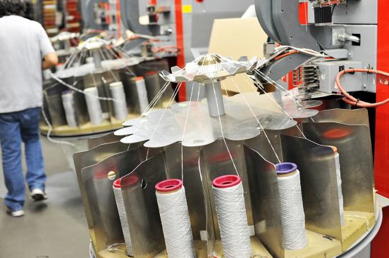 The excess yarn is sorted by color and unraveled as part of the reclamation process. The fiber will be re-melted, pelletized, blended, and then re-extruded back into fiber. According to Interface, this process uses half of the embodied energy that would otherwise be required to create new fiber from raw materials&nbsp;from the earth.