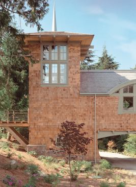 Custom Home, January-February 2006  On Site  Bernie Baker Architect, Bainbridge Island, Wash.   A library tower with its own balcony stands sentinel at the entrance to this shingled house on Guemes Island, Wash.