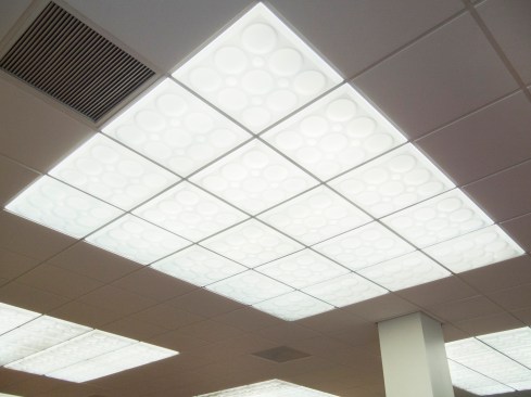 New thermoformed panels, like the Roman Circles style that were used at the Sunkist branch, were dropped into the existing support grid. 